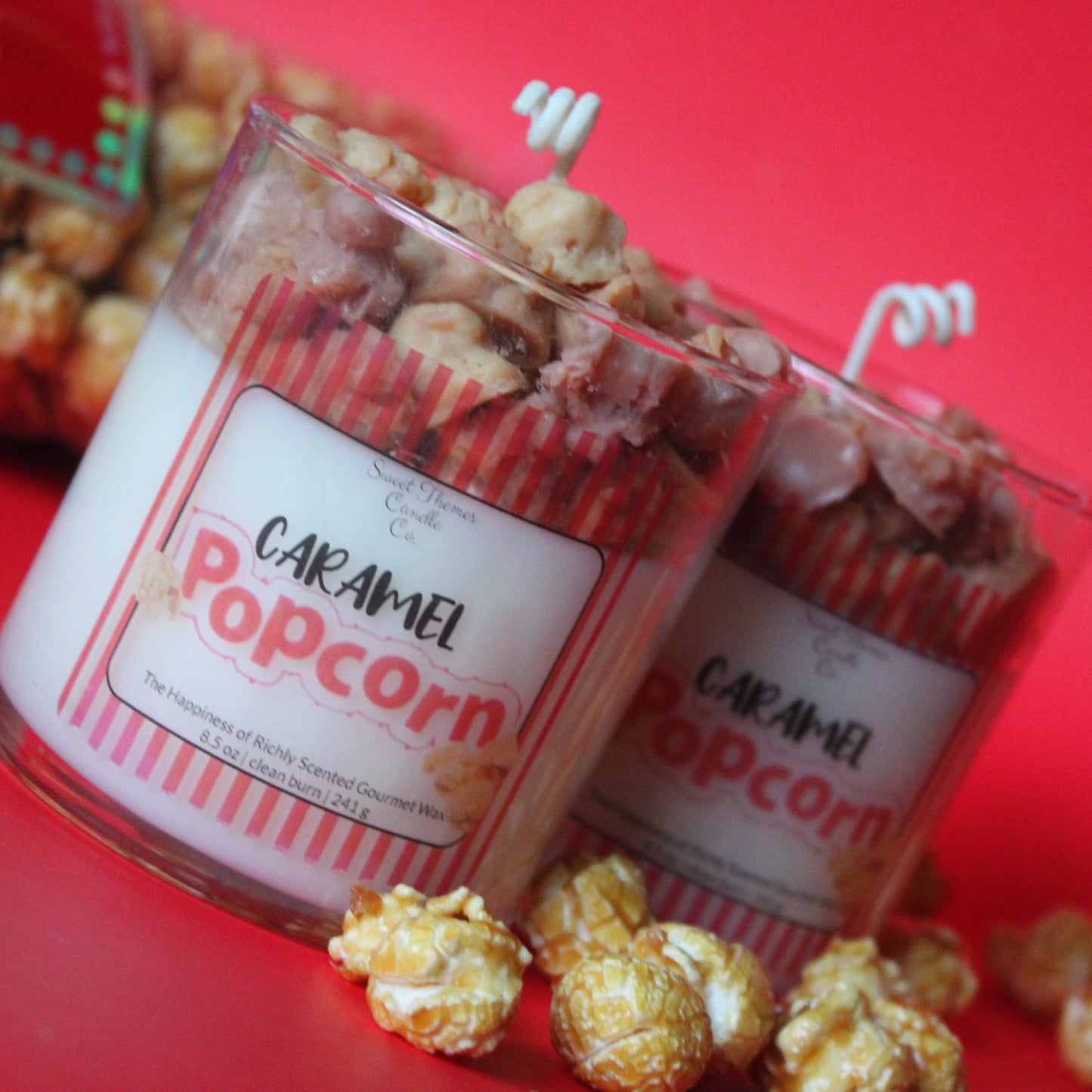 Caramel popcorn in a clear container with a label on a red background
