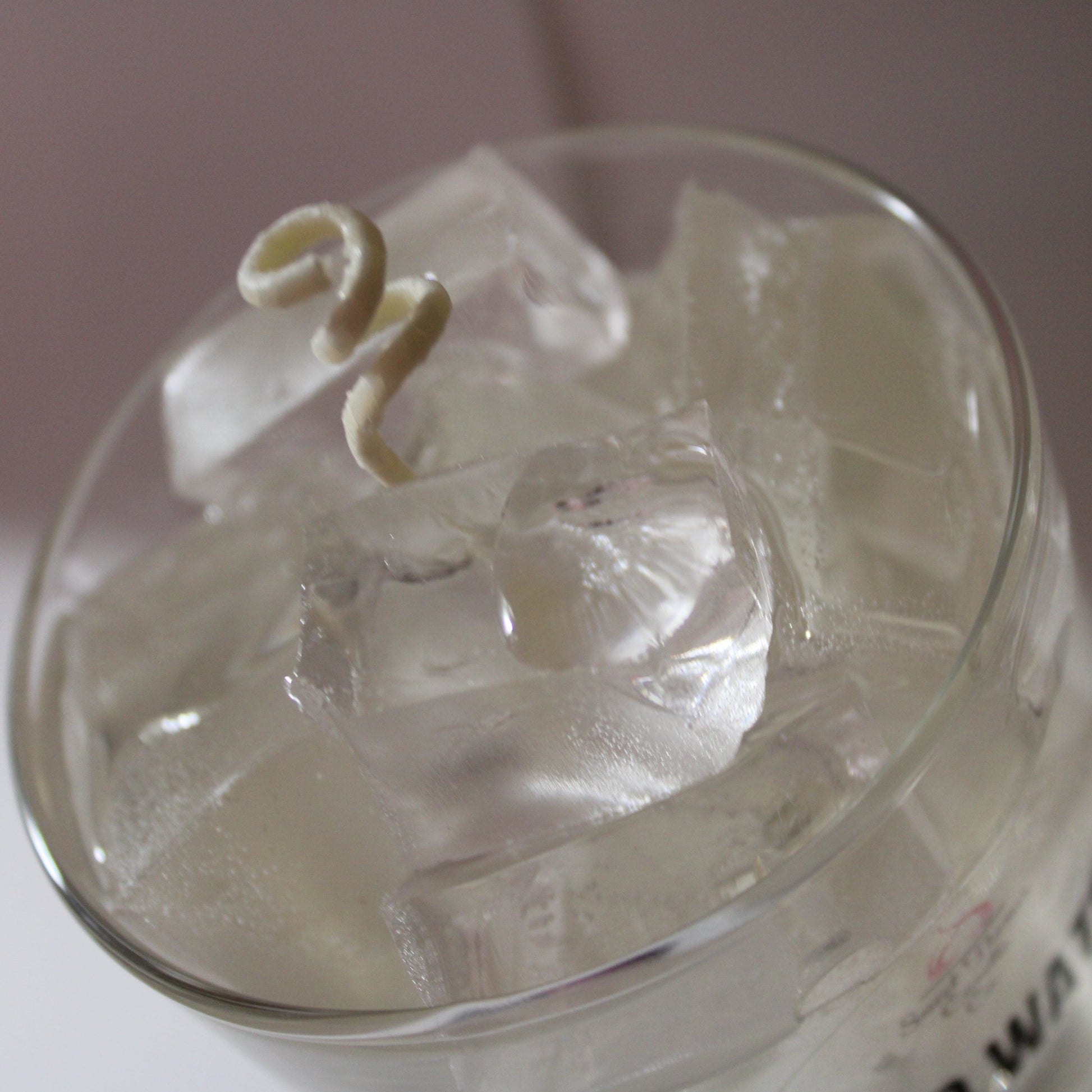 Clear glass container with chilled ice cubes